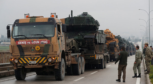 A Turkish military convoy arrives at an army base in the border town of Reyhanli near the Turkish-Syrian border in Hatay province